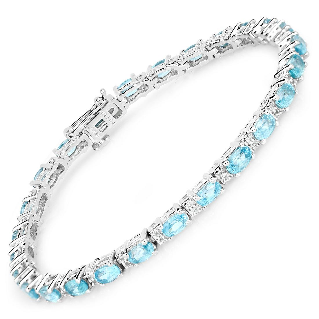 Plated Rhodium 8.58ctw Blue Zircon and White Topaz Bracelet: 8.84 Carat Genuine Blue Zircon and Topaz White.925 Sterling Silver Bracelet. White Topaz Round/1.00mm - 52/0.26 ctw Natural Heat Treated C + Blue Zircon Oval/5x3mm - 26/8.58 ctw. Total weight 11.67 gr