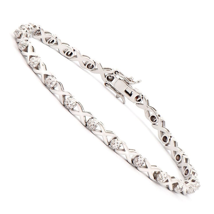 Plated Rhodium 0.2cts Diamond Bracelet: One Plated 0.2cts Diamond Rhodium Bracelet. (23) diamonds with a total of 0.2cts with a color of H-I and clarity of I-3. Total weight of this bracelet is 8.7 grams.
