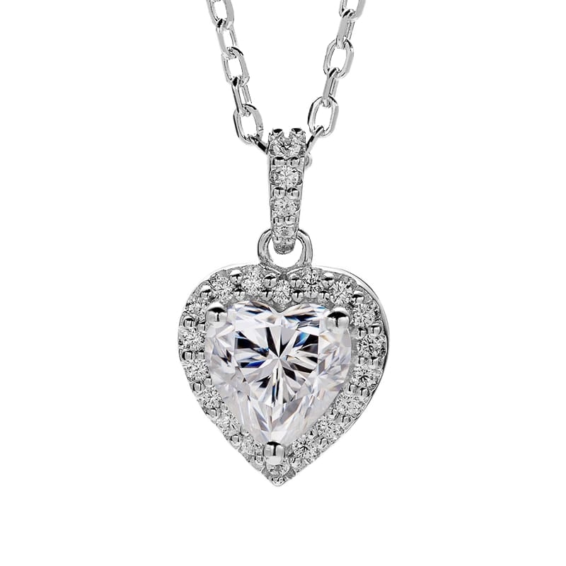 Sparkling 1ct VVS1 White G-H Fire Heart Moissanite Pendant: This Fire Moissanite is a VVS1 Brilliant Heart Cut. The Color is White G-H measuring approx. 6.5 mm. This Fire 1 Ct Moissanite is near flawless and bursting out with a full spectrum of colors. It is m