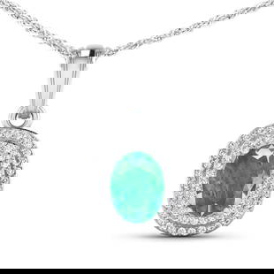 14KT White Gold 1.00ct Emerald and Diamond Pendant with Chain: (1) Oval Zambian Emerald stone with a total weight of 1.00ct. (58) round Diamonds with a total weight of 0.26cts with a color of (i) and a clarity of i1-i2. Total weight of this pendant with chain is