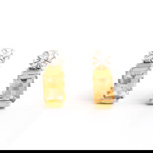 Plated 18KT Yellow Gold1.12cts Citrine and Diamond Earrings: One pair of Plated 18KT Yellow Gold1.12cts Citrine And Diamonds Earrings. (2) Orange Citrine stones with a total weight of 1.1cts. (2) diamonds with a total of 0.02cts with a color of H-I and clarity
