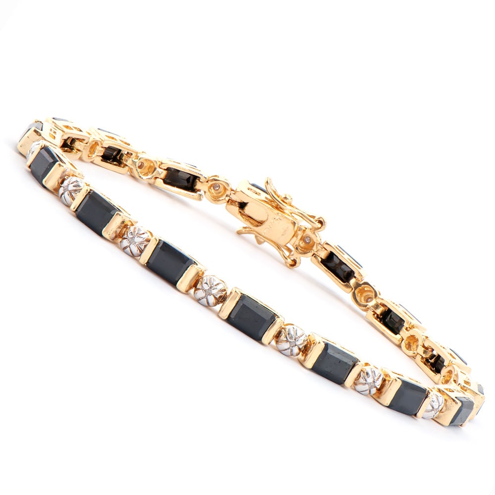 Plated 18KT Yellow Gold 12.00ctw Black Sapphire and Diamond Bracelet: One Plated 18KT Yellow Gold 12.00ctw Black Sapphire and Diamond Bracelet. (16) Black Sapphire stones with a total weight of 12.00cts. (16) Diamonds with a total weight of 0.012cts with a color of I-J 