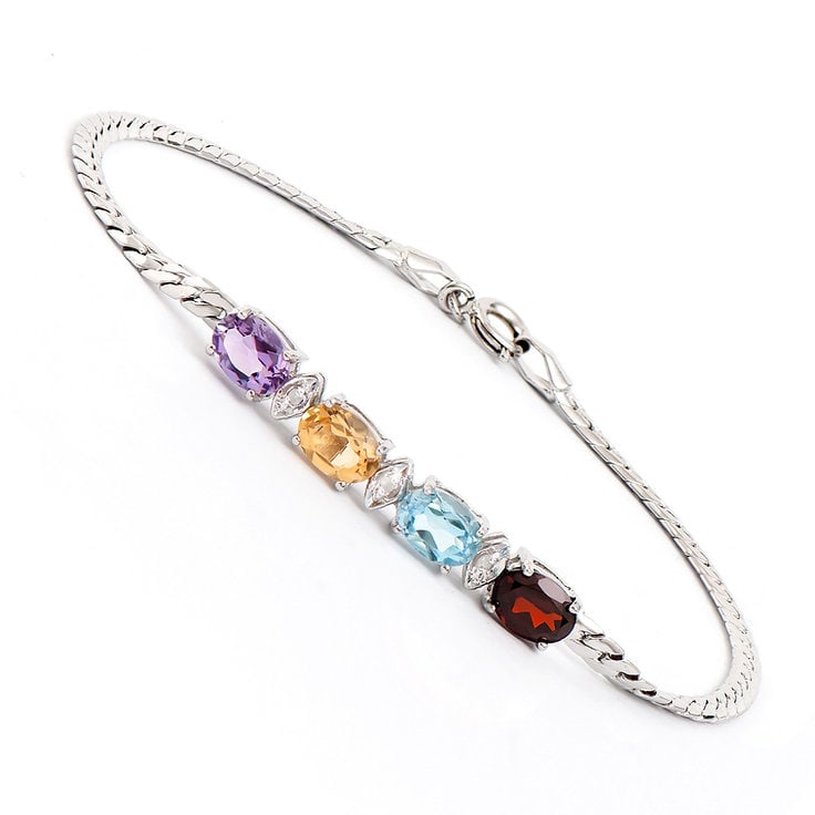 Plated Rhodium 3.35cts Multistone and Diamond Bracelet: One Plated 3.35cts Multistone and Diamond Rhodium Bracelet 7.8 in. (4) Multi stones with a total weight of 3.32cts. (3) diamonds with a total of 0.03cts with a color of H-I and clarity of I-3. Total w