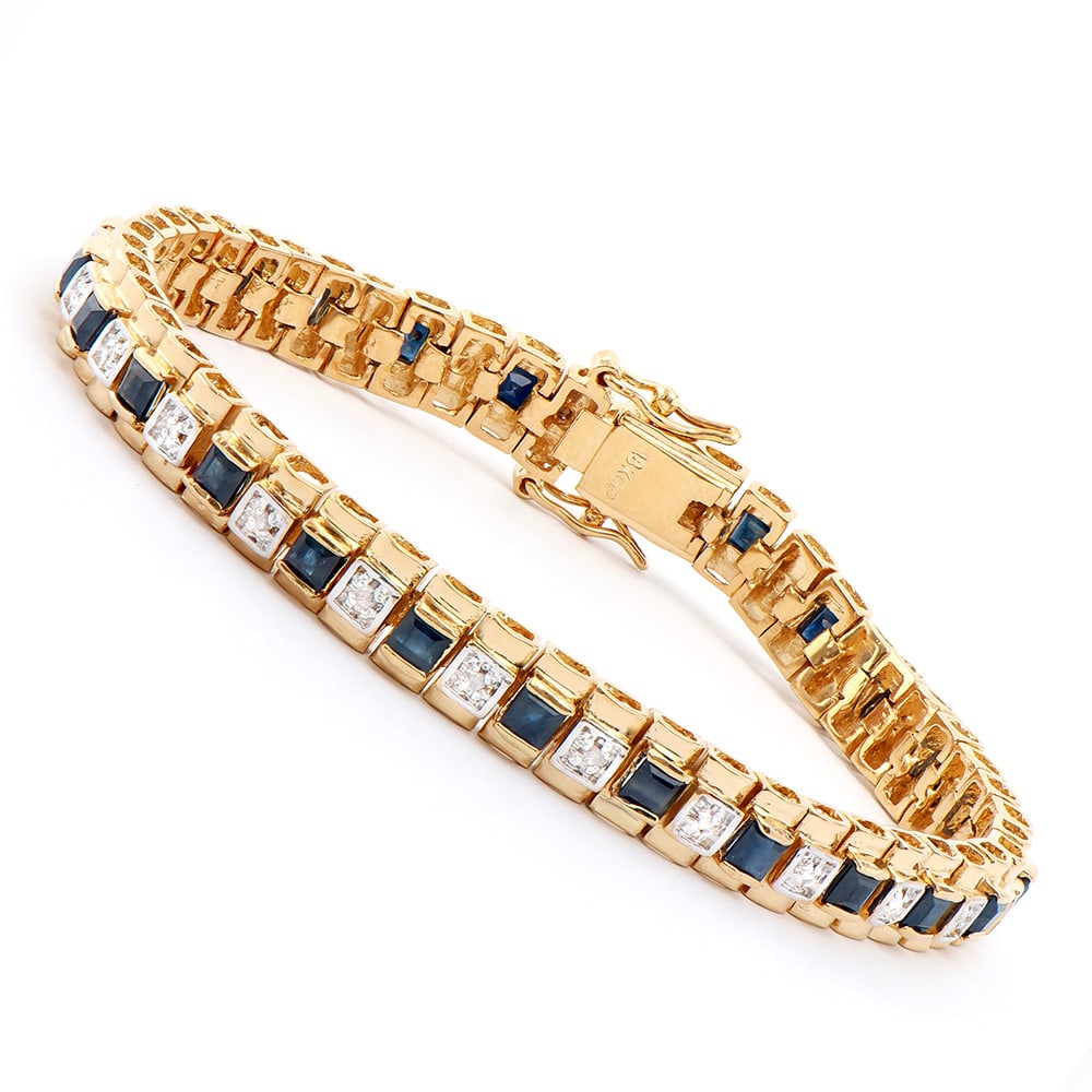Plated 18KT Yellow Gold 5.00ctw Black Sapphire and Diamond Bracelet: One Plated 18KT Yellow Gold 5.00ctw Black Sapphire and Diamond Bracelet. (25) Black Sapphire stones with a total weight of 5.00cts. (4) Diamonds with a total weight of 0.04cts with a color of I-J and 
