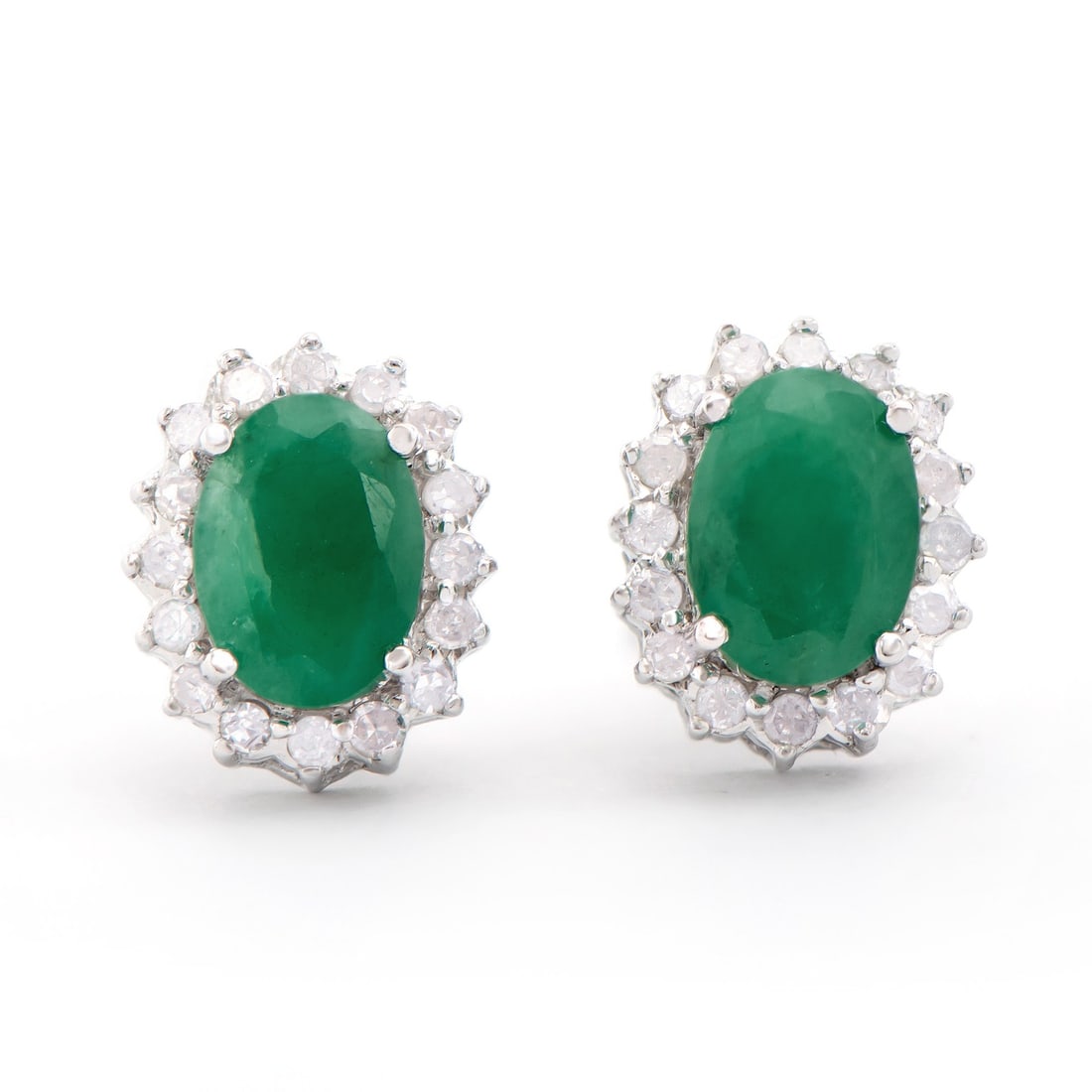 14KT White Gold 1.50ctw Emerald and Diamond Earrings: (2) Emeralds with a total weight of 1.50cts. (32) round Diamonds with a total weight of 0.26cts with a color of H-I and clarity of I2-I3. Total weight of these earrings are 2.00 grams.