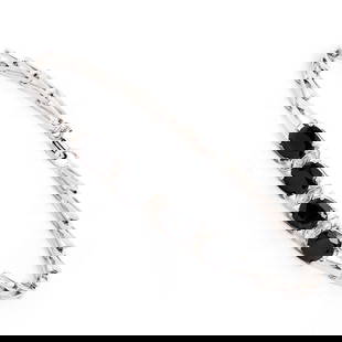 Plated Rhodium 4.05cts Black Sapphire and Diamond Bracelet: One Plated 4.05cts Black Sapphire and Diamond Rhodium Bracelet 7.5 in. (4) Black Sapphire stones with a total weight of 4.02cts. (3) diamonds with a total of 0.03cts with a color of H-I and clarity of