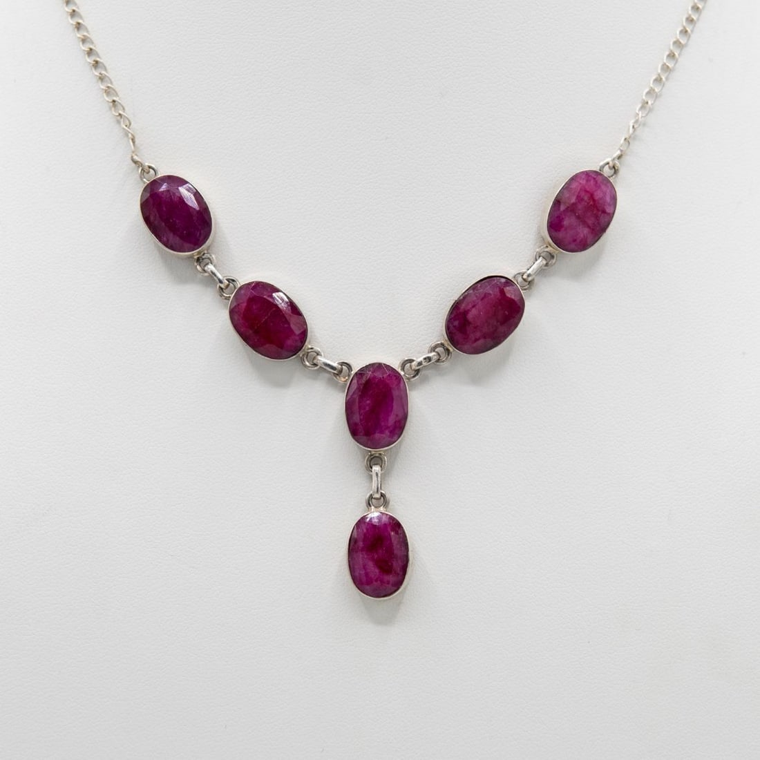 Solid Sterling Silver Natural 41 Ct Ruby Necklace: Ladies Sterling Silver Ruby Necklace Featuring Bezel Set Oval Faceted Cut Rubies Weighing Approx. 41.50Ct. Length 18". Weight 17.7 Grams