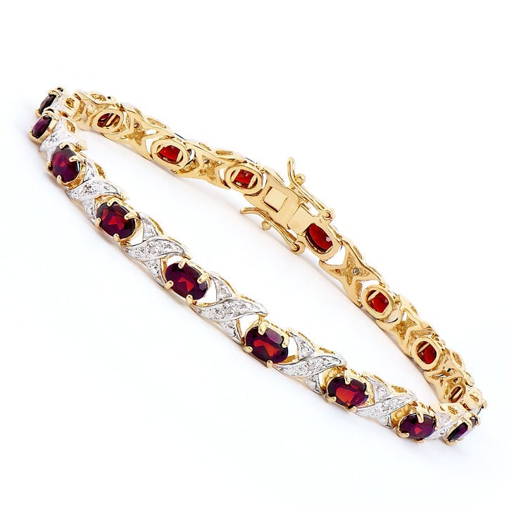 Plated 18KT Yellow Gold 7.20ctw Garnet and Diamond Bracelet: One Plated 18KT Yellow Gold 7.20ctw Garnet and Diamond Bracelet. (16) Garnet stones with a total weight of 7.20cts. (16) Diamonds with a total of 0.14cts with a color of H-I and clarity of I-3. Total 