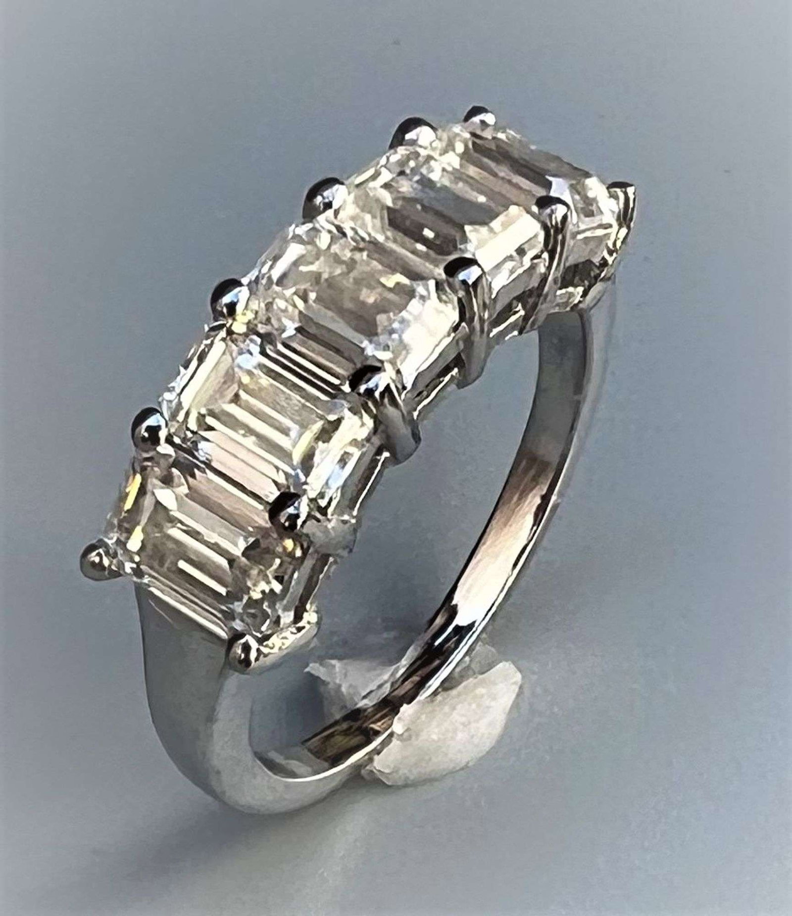 Stunning 5.07 Ct VVs1 F-G Fire Moissanite Ring: These 5 Emerald Cut Moissanites are VVs1 Clarity and F-G in color measuring approx. 6.5 x 4.5 mm. These investment grade Moissanites are near flawless and bursting out with a full spectrum of colors. 
