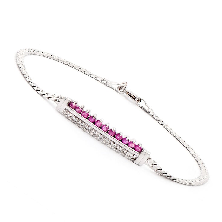Plated Rhodium 0.6cts Ruby and Diamond Bracelet: One Plated 0.6 TWcts Ruby and Diamonds Rhodium Bracelet. (11) Red Ruby stones with a total weight of 0.51cts. (11) diamonds with a total of 0.09cts with a color of H-I and clarity of I-3. Total weight