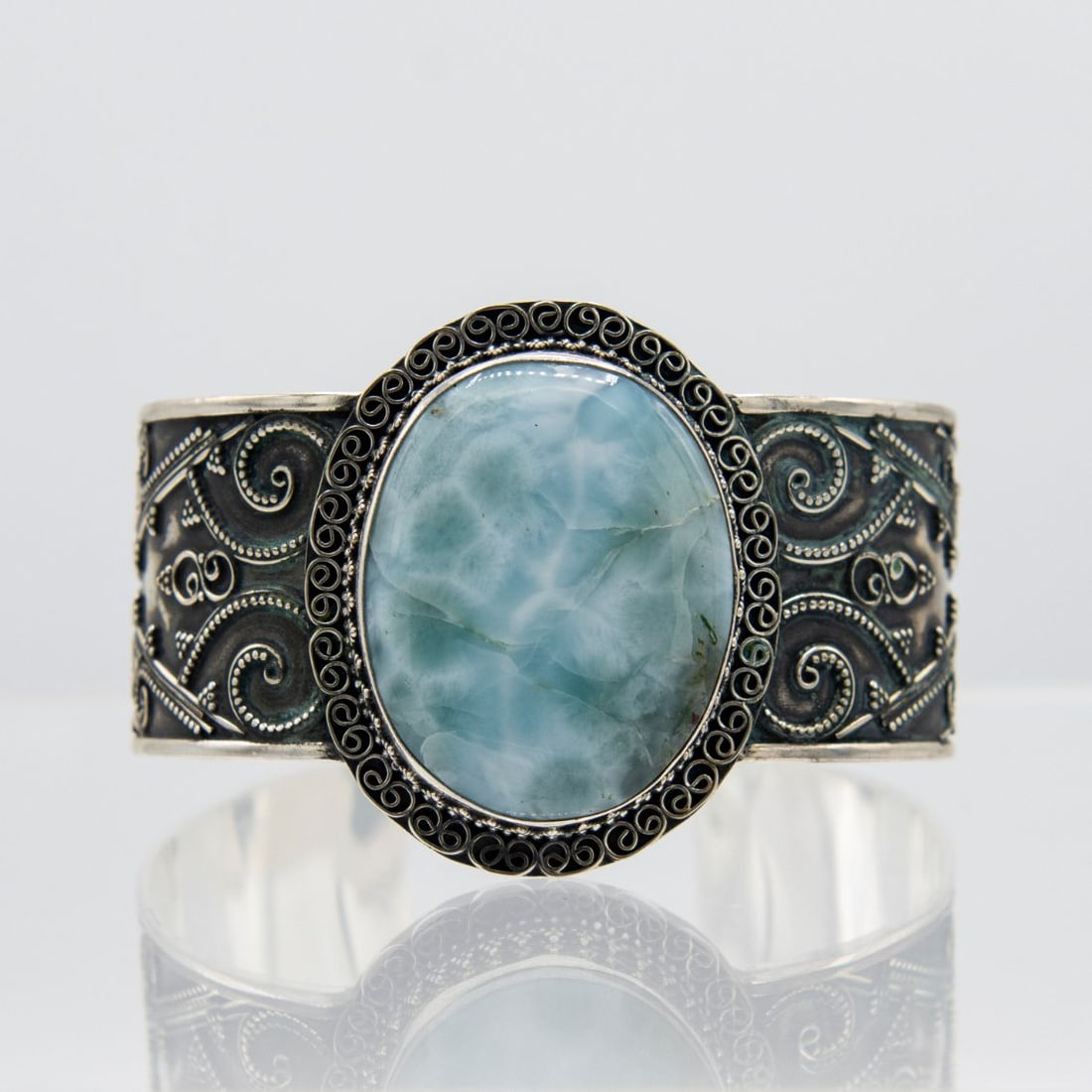 Gorgeous 42 Ct Larimar Cuff Bangle Bracelet: Gorgeous 42 Ct Larimar Cuff Bangle Bracelet. Highly Polished Cabochon Cut. Mounted In Elaborately Designed .925 Sterling Silver Overlay. Total Gram Weight Is 62 Grams Or 308 Cttw. Adjustable So It Wil