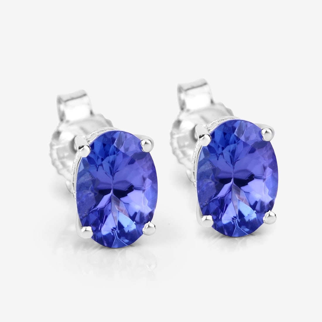 14KT White Gold 1.20ctw Tanzanite Earrings: Tanzanite Oval/6.50x4.50mm - 2/1.20 ctw Prong Setting Natural Heat Treated E Total weight of 1.12 grams.