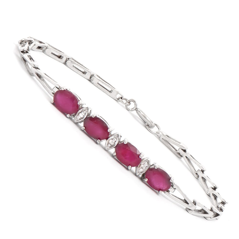 Plated Rhodium 4.05ctw Ruby and Diamond Bracelet: One Plated Rhodium 4.05ctw Ruby and Diamond Bracelet. (4) Rubies with a total weight of 4.05cts. Diamonds with a total weight of 0.03cts with a color of I-J and clarity of I-3. Total weight of this br