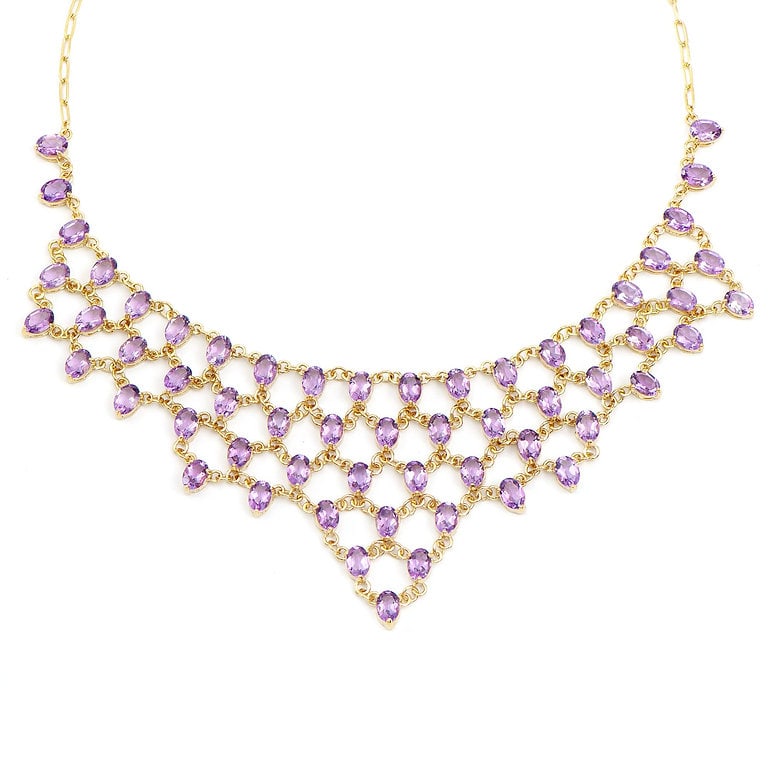 Plated 18KT Yellow Gold 42.00cts Amethyst Necklace: One Plated 18KT Yellow Gold 42.00cts Amethyst Necklace 19 in. (59) Violet Amethyst stones with a total weight of 42.0cts. Total weight of this necklace is 35.11 grams.