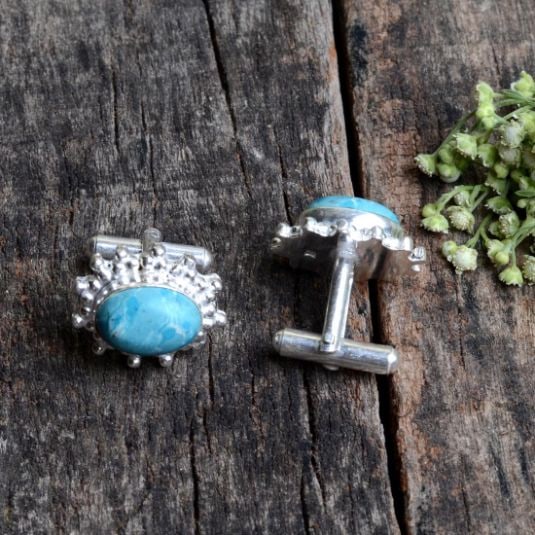 Men's Lab Created Blue Larimar Cufflinks: The Larimar total gem Wt is approx. 12 Cttw. Each larimar gem is a polished cabochon cut mounted in .925 stamped silver overlay. The total gram wt is 13.5 grams or 67.5 Cttw.