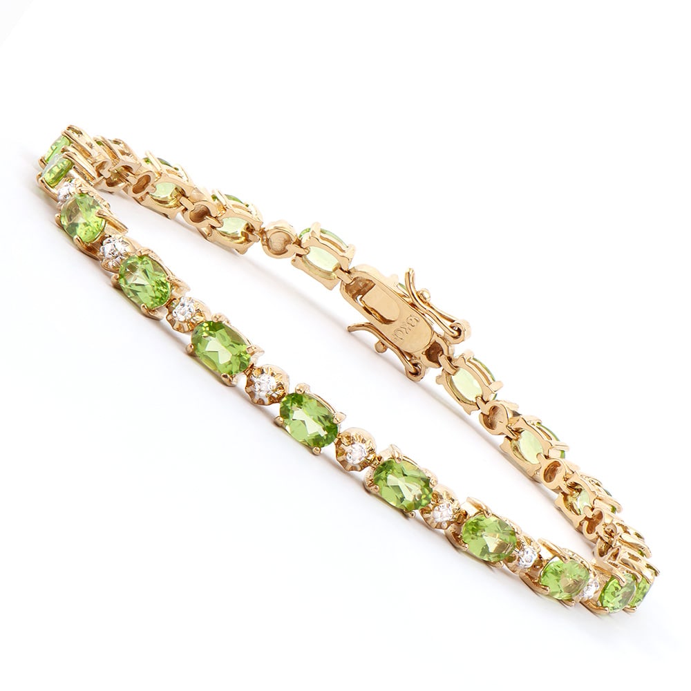 Plated 18KT Yellow Gold 9.00ctw Peridot and Diamond Bracelet: One Plated 18KT Yellow Gold 9.00ctw Peridot and Diamond Bracelet. (20) Peridot stones with a total weight of 9.00cts. Diamonds with a total weight of 0.025cts with a color of I-J and clarity of I-3. T