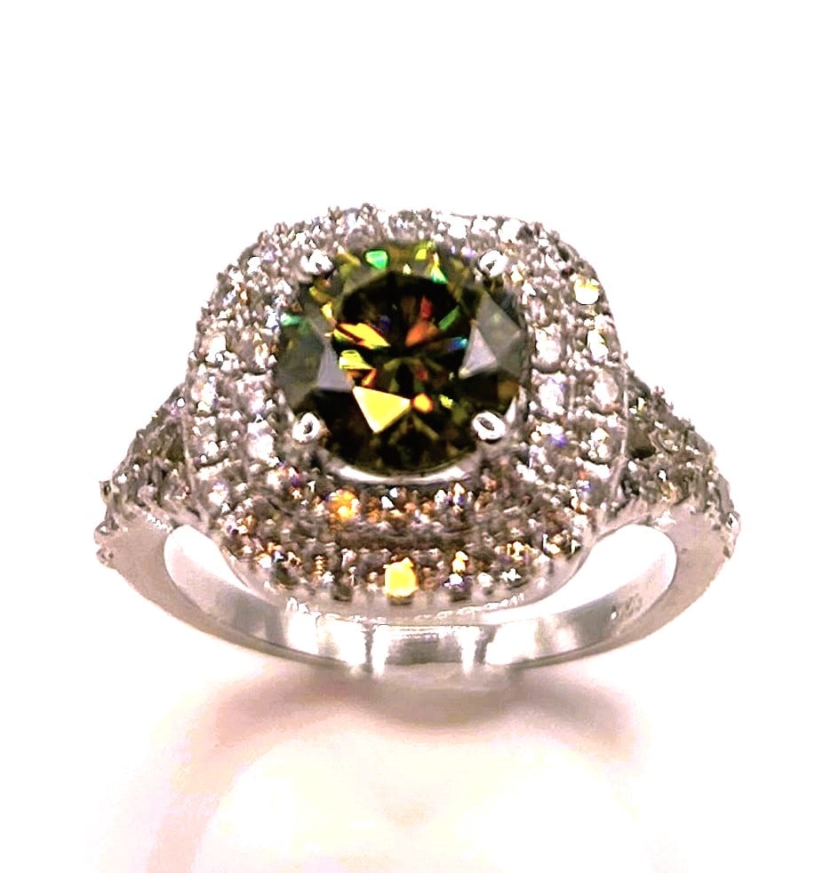 2.75ct VVs1 Golden Green Amber Moissanite Ring: Dazzling 2.75 Ct VVs1 Golden Green Amber Fire Moissanite Ring. This 2.75 Ct Fire Moissanite Solitaire is a VVS1 Brilliant Round Cut. The Color is a Fire Amber Whiskety Green. The Clarity is VVS-1. Mea