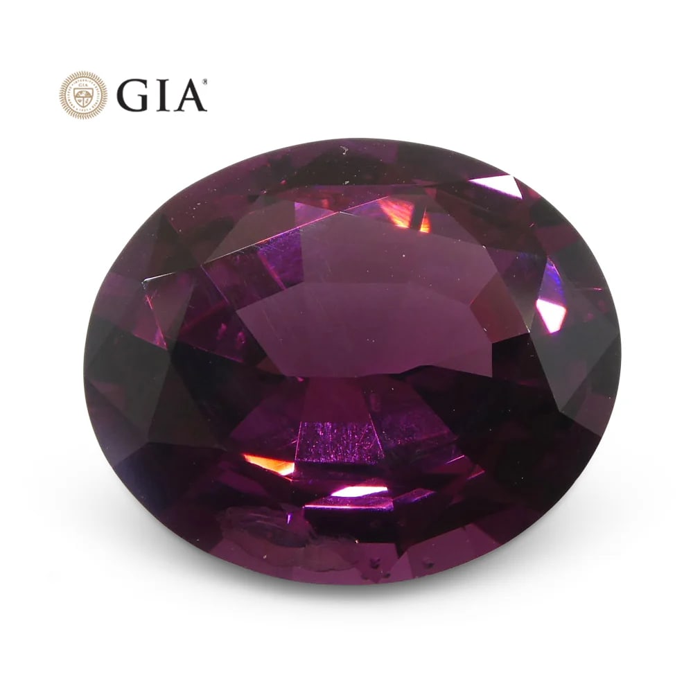 Unheated 7.43 Ct GIA Certified Natural Spinel: Unheated 7.43 Ct Brilliant Oval Cut Red Purple Spinel measuring 13.81 x 11.57 x 6.52 mm. This Gem has a Dazzling Red-Purple hue and a Vivid Saturation. Don't hesitate on this one!! Treatment: None. Pl