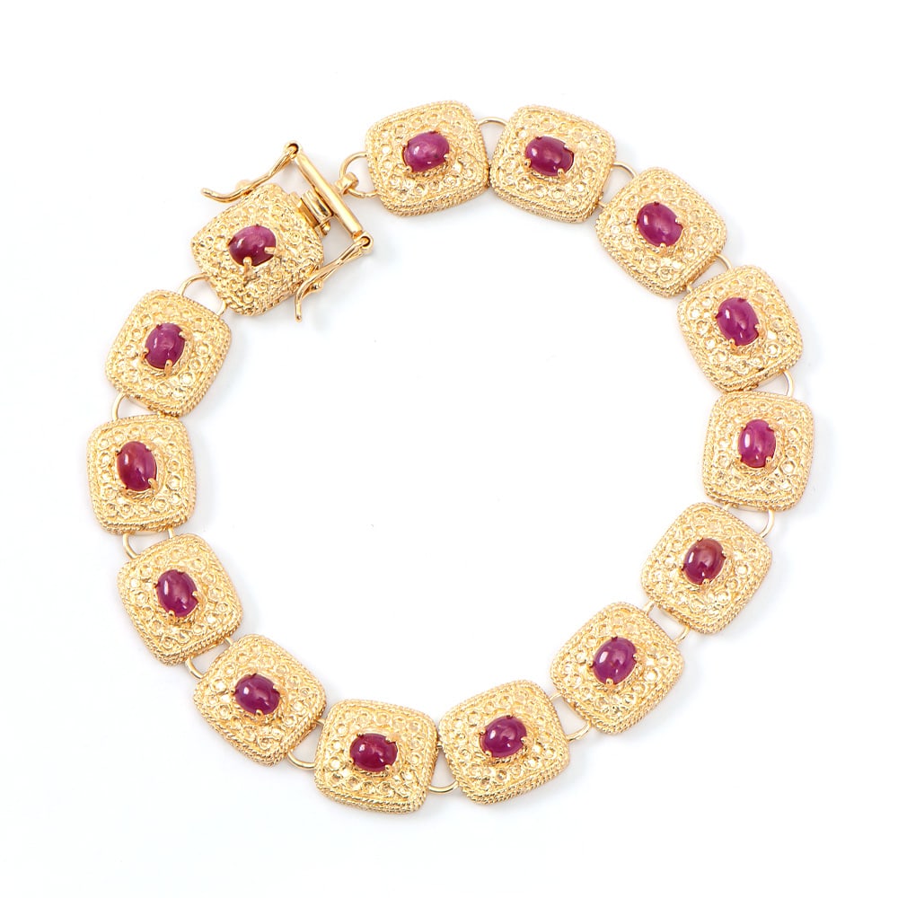 Plated 18KT Yellow Gold 8.00ctw Ruby Bracelet: One Plated 18KT Yellow Gold 8.00ctw Ruby Bracelet. (14) Rubies with a total weight of 8.00cts. Total weight of 17.55 grams of brass layered with 18K yellow gold. The length of this bracelet is 7 1/2 i