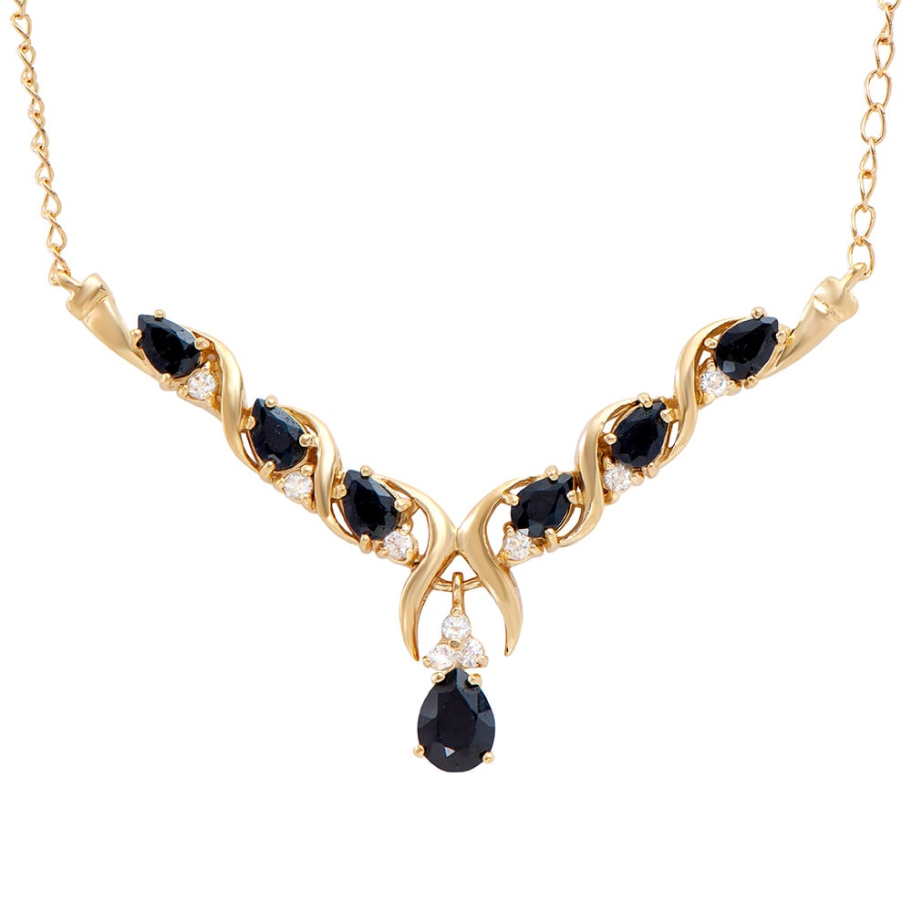 Plated 18KT Yellow Gold 4.50ctw Black Sapphire and White Topaz Pendant with Chain: One Plated 18KT Yellow Gold 4.50ctw Black Sapphire and White Topaz Pendant with Chain. (7) Black Sapphire stones with a total weight of 4.50cts. (9) white topaz stones with a total weight of 0.50cts. 