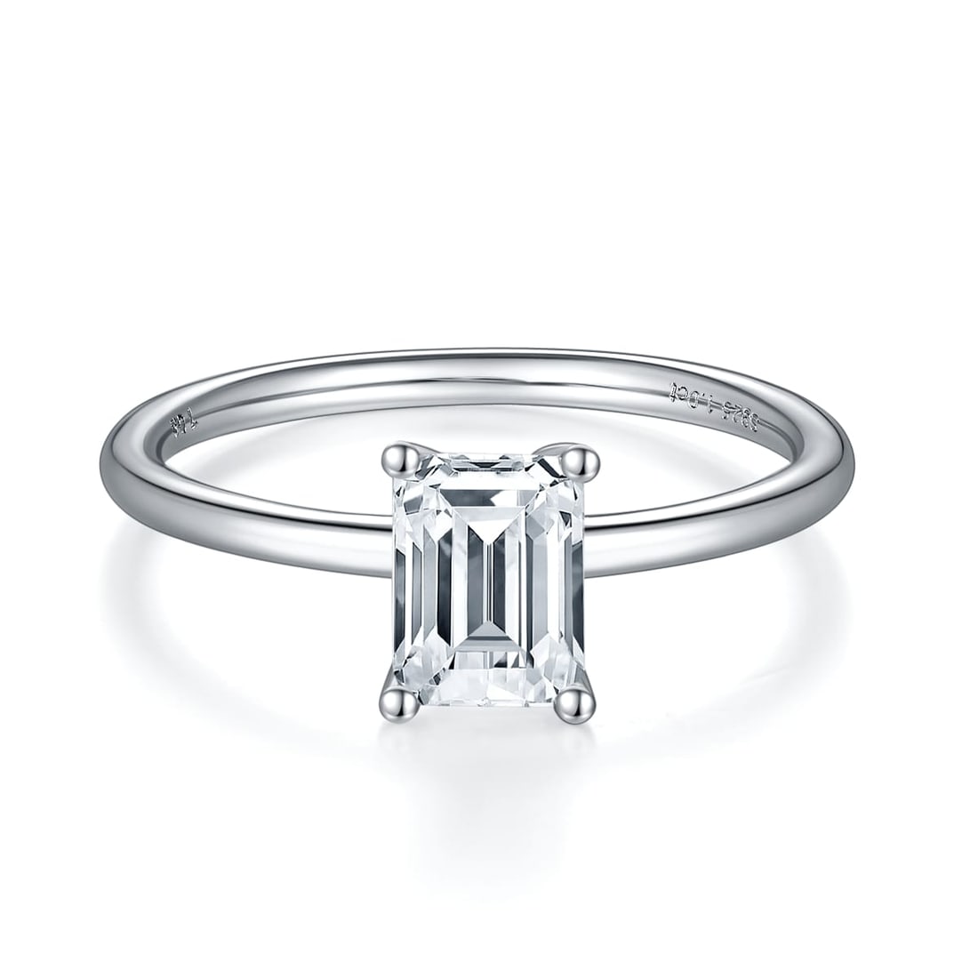 Emerald Cut 1.00ct VVS1 White G-H Fire Moissanite Ring: This 1 CT. Fire Moissanite is a VVS1 Brilliant Emerald Cut. The Color is White G-H measuring approx. 6.5mm.This Fire Moissanite is near flawless and bursting out with a full spectrum of colors. It is 