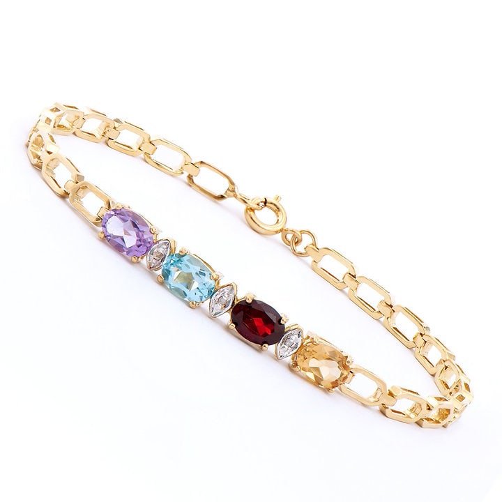 Plated 18KT Yellow Gold 3.85ctw Multi Color Gem and Diamond Bracelet: One Plated 18KT Yellow Gold 3.85ctw Multi Color Gem and Diamond Bracelet. (1) Blue Topaz stone, (1) Amethyst stone, (1) Garnet Stone and (1) Citrine stone all with a total weight of 3.85cts. (3) diamo