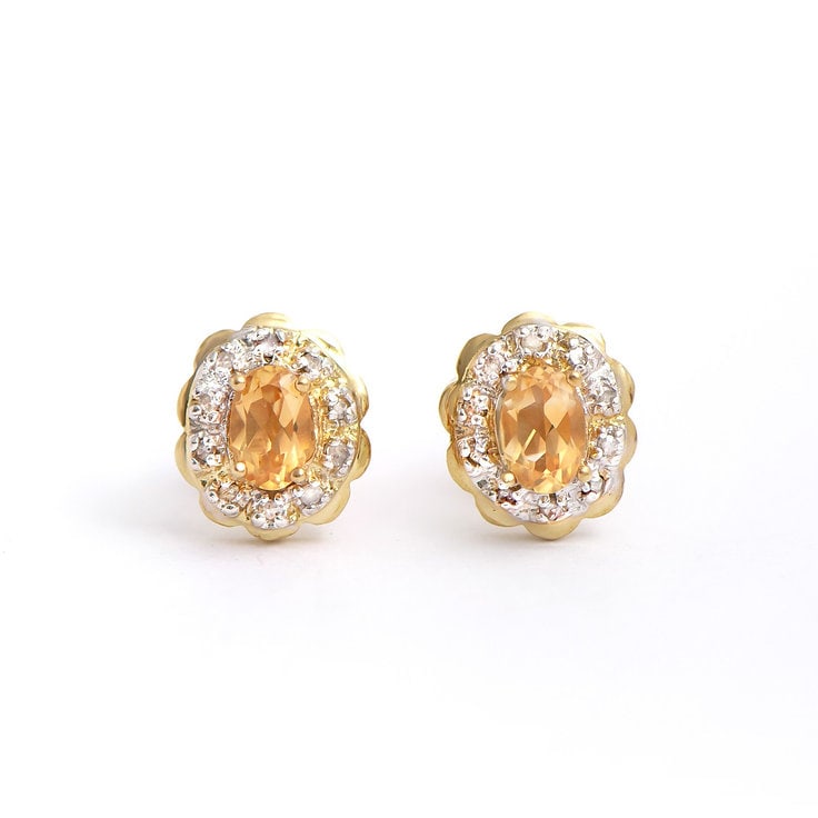 Plated 18KT Yellow Gold 0.96cts Citrine and Diamond Earrings: One pair of Plated 18KT Yellow Gold 0.96cts Citrine and Diamonds Earrings. (2) Orange Citrine stones with a total weight of 0.8cts. (20) diamonds with a total of 0.16cts with a color of H-I and clarit
