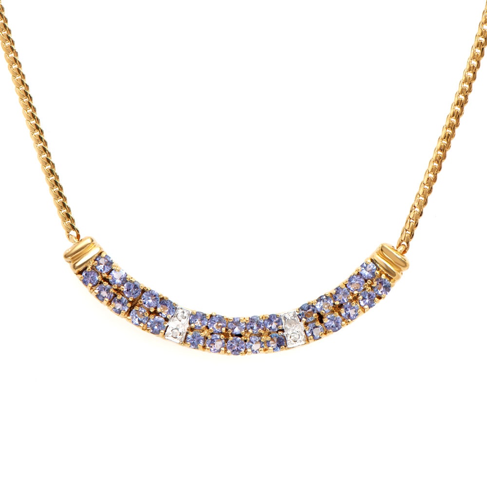 Plated 18KT Yellow Gold 1.65ctw Tanzanite and Diamond Pendant with Chain: One Plated 18KT Yellow Gold 1.65ctw Tanzanite and Diamond Pendant with Chain. (30) tanzanite stones measuring 2.4mm. (4) round diamonds measuring 1.1mm. Total weight of this pendant with chain is 7.05