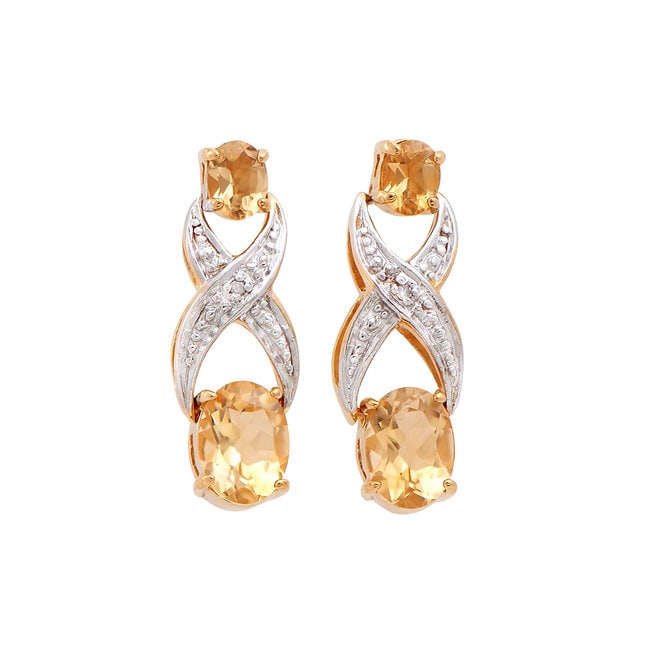 Plated 18KT Yellow Gold 2.66cts Citrine and Diamond Earrings: One pair of Plated 18KT Yellow Gold 2.66cts Citrine and Diamond Earrings. (4) Orange Citrine stones with a total weight of 2.64cts. (2) diamonds with a total of 0.02cts with a color of H-I and clarity