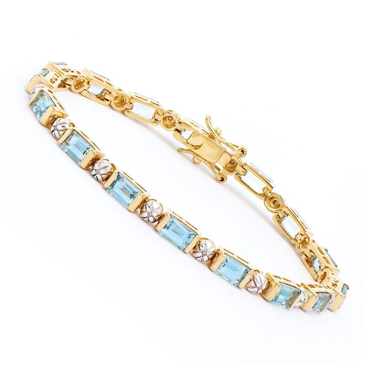 Plated 18KT Yellow Gold 11.30ctw Blue Topaz and Diamond Bracelet: One Plated 18KT Yellow Gold 11.30ctw Blue Topaz and Diamond Bracelet. (16) Blue Topaz stones with a total weight of 11.30cts. (16) Diamonds with a total of 0.013cts with a color of H-I and clarity of 