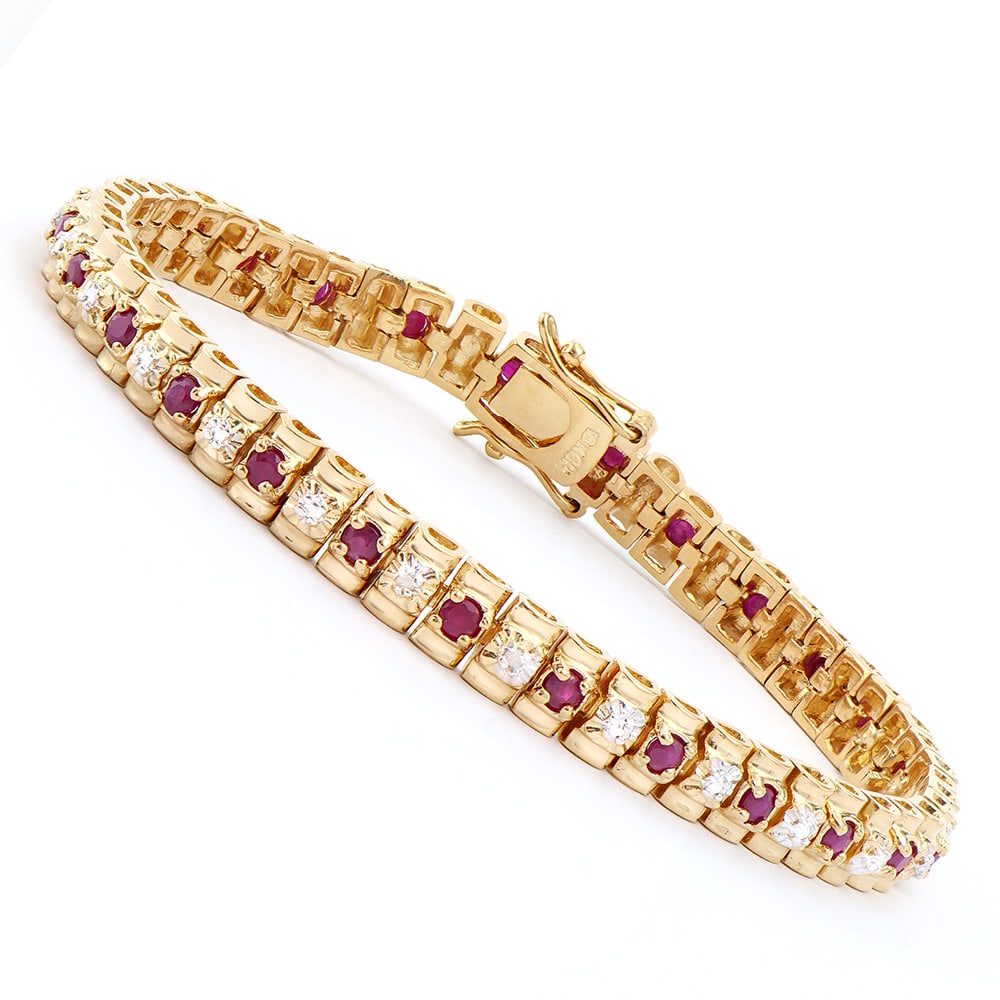 Plated 18KT Yellow Gold 2.50ctw Ruby and Diamond Bracelet: One Plated 18KT Yellow Gold 2.50ctw Ruby and Diamond Bracelet. (27) Rubies with a total weight of 2.50cts. Diamonds with a total weight of 0.015cts with a color of I-J and clarity of I-3. Total weight