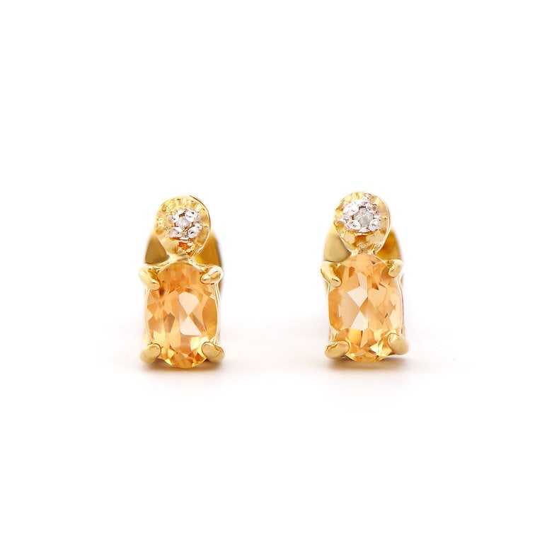 Plated 18KT Yellow Gold 0.82cts Citrine and Diamond Earrings: One pair of Plated 18KT Yellow Gold 0.82cts Citrine And Diamonds Earrings. (2) Orange Citrine stones with a total weight of 0.8cts. (2) diamonds with a total of 0.02cts with a color of H-I and clarity