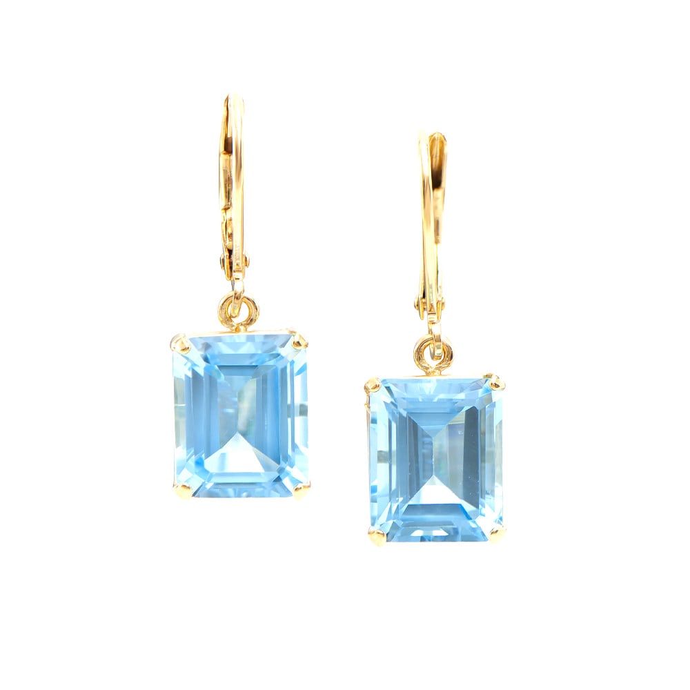 Plated 18KT Yellow Gold 10.05ctw Blue Topaz Earrings: One pair of Plated 18KT Yellow Gold 10.05ctw Blue Topaz Earrings. (2) Blue Topaz stones with a total weight of 10.05cts. 3.85 grams of brass layered with 18K yellow gold.