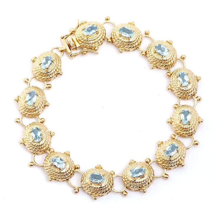 Plated 18KT Yellow Gold 6.25cts Blue Topaz Bracelet: One Plated 18KT Yellow Gold 6.25cts Blue Topaz Bracelet 8.1 in. (12) Blue Topaz stones with a total weight of 6.25cts. Total weight of this bracelet is 21.22 grams.