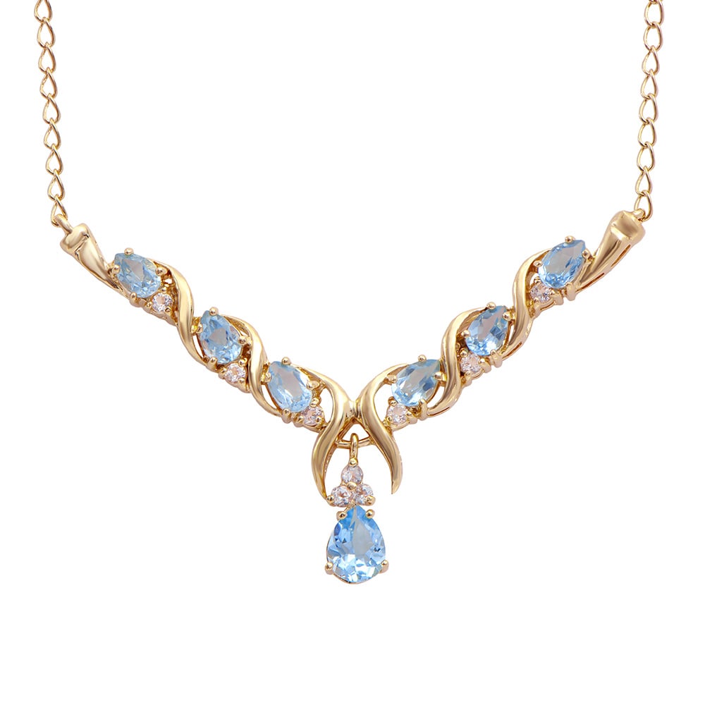 Plated 18KT Yellow Gold 4.00ctw Blue and White Topaz Pendant with Chain: One Plated 18KT Yellow Gold 4.00ctw Blue and whiteTopaz Pendant with Chain. (7) Blue Topaz stones with a total weight of 4.00cts. (9) white topaz stones with a total weight of 0.40cts. 7.55 grams of b