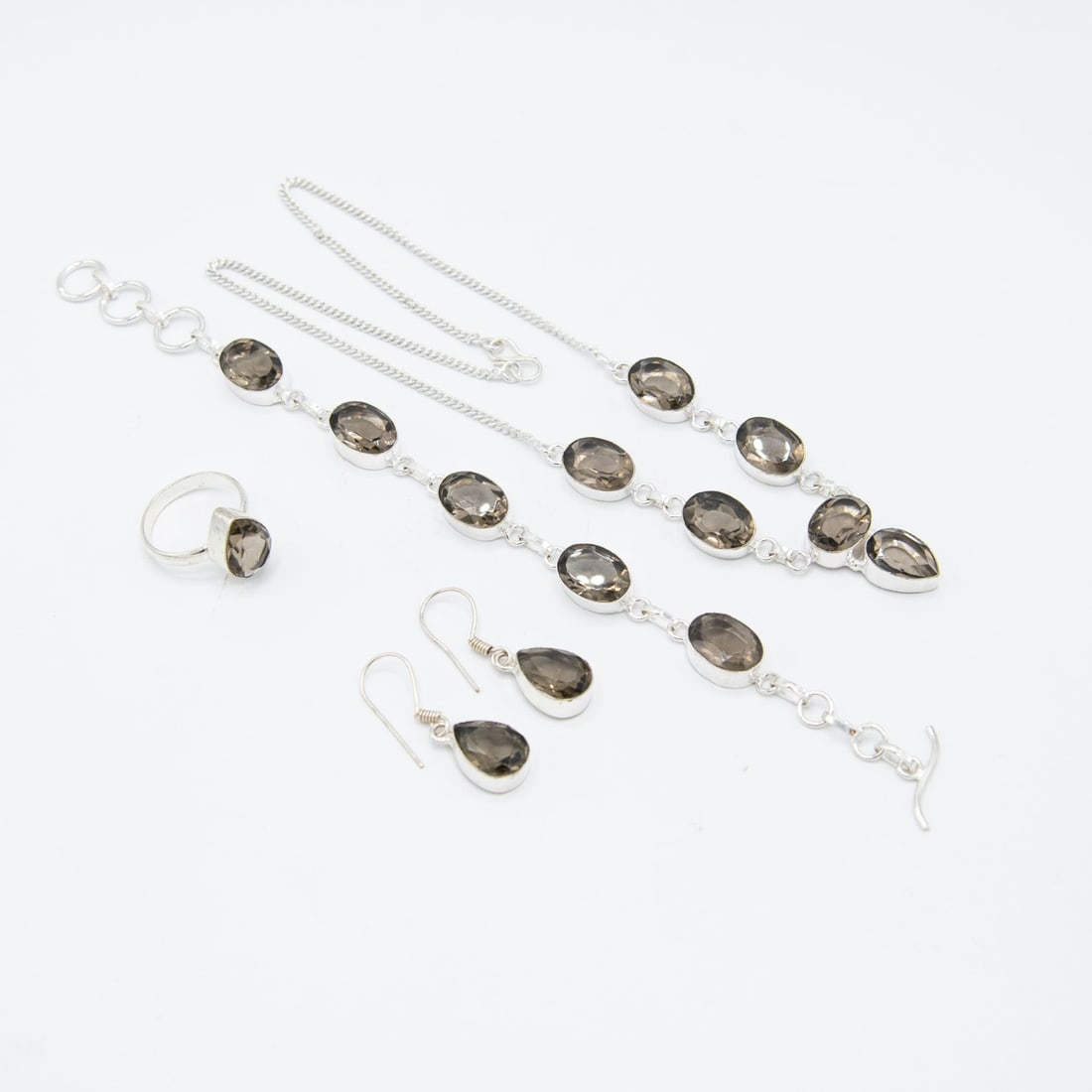 Gorgeous Imperial Topaz 4 Piece Jewelry Set: These lab made topaz are near flawless. They burst out with a brilliant sparkle and a fine even tone. The 4 piece set includes an 18 inch 38 Ct necklace, bracelet, earrings, and the finger ring size i