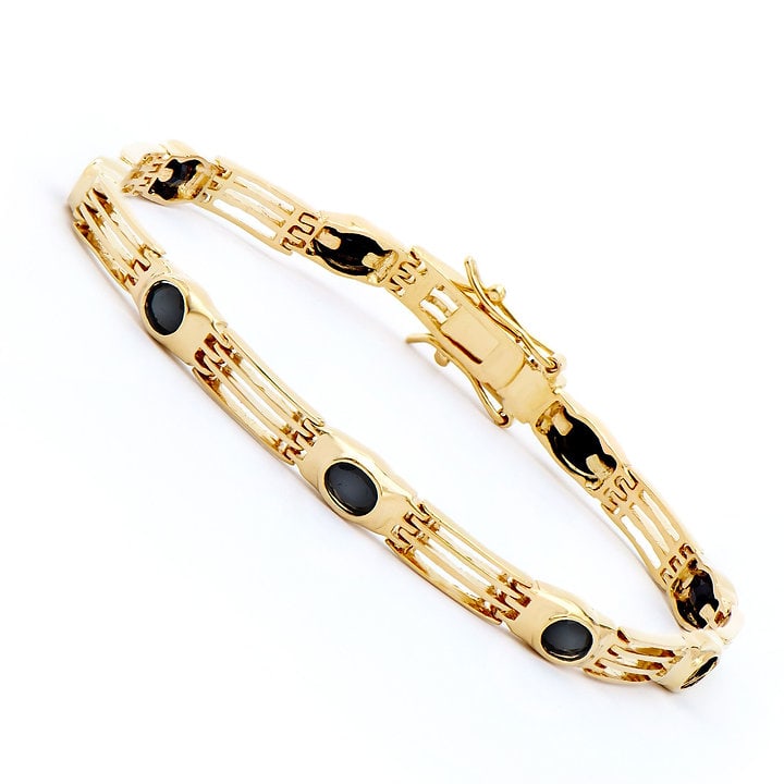 Plated 18KT Yellow Gold 5.65ctw Black Sapphire Bracelet: One Plated 18KT Yellow Gold 5.65ctw Black Sapphire Bracelet. (9) Black Sapphires with a total weight of 5.65cts. Total weight of this bracelet is 9.29 grams. The length of this bracelet is 7 1/2 inche