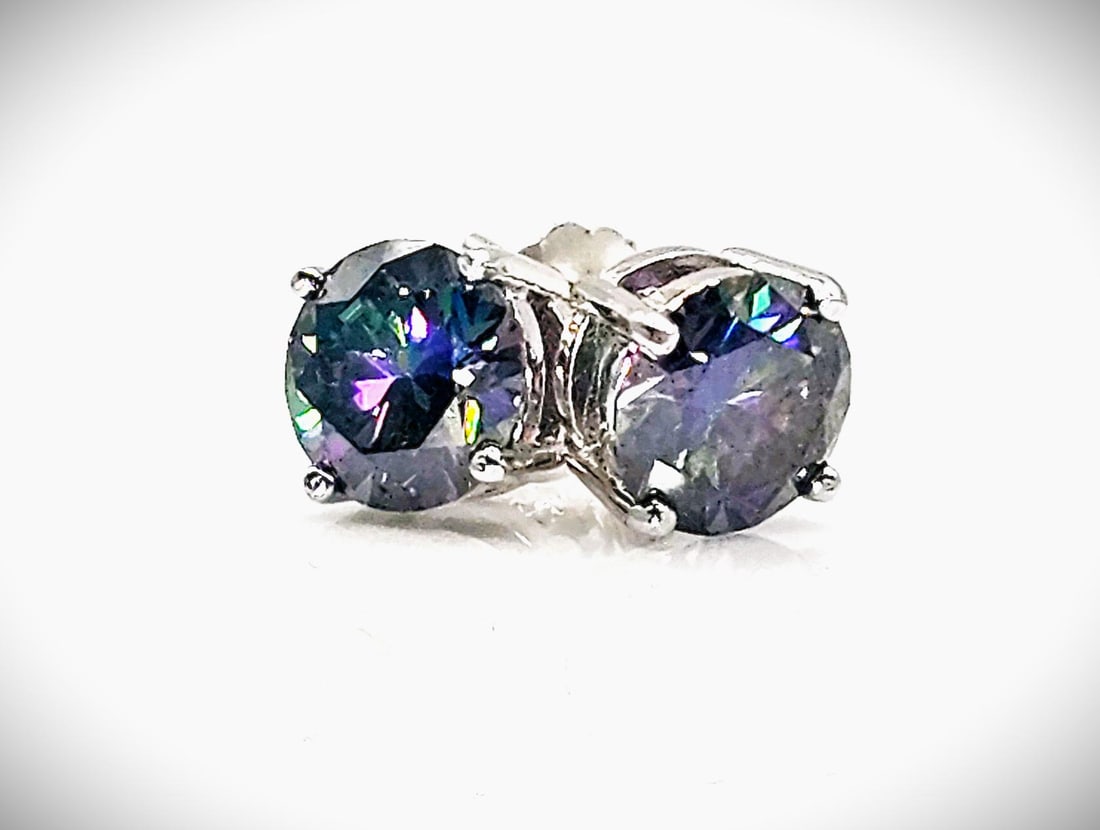 4 Ctw Rare Russian Color Change Lab Created Alexandrite Earrings: This Pair of Russian 2 Ct Lab Created Color Change Alexandrite's are both VVs1 Eye-Clean Fine Brilliant Round Cust Measuring 8mm. for a 4 Ct Total Gem Weight. The color spectrum ranges from beautiful 