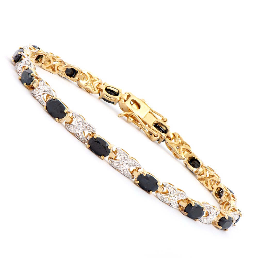 Plated 18KT Yellow Gold 8.25ctw Black Sapphire and Diamond Bracelet: One Plated 18KT Yellow Gold 8.25ctw Black Sapphire and Diamond Bracelet. (13) Black Sapphire stones with a total weight of 8.25cts. Diamonds with a total weight of 0.10cts with a color of I-J and clar