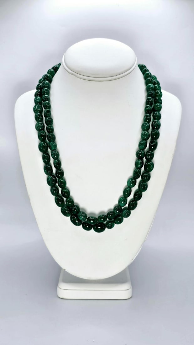 Lovely Huge 633 Ctw Natural Mined From The Earth Emerald Necklace: Beautiful Bright Emerald Green 633 Ctw Emerald Necklace.These mined from the earth natural emerald beads are approx 10 to 13 mm. in size. It measures approx 18-20" in length. Treated to enhance color.