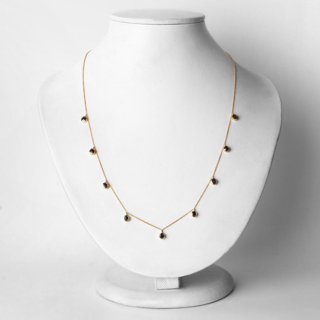 10KT Yellow Gold 1.08ctw Blue Sapphire Necklace: Blue Sapphire Round/3.00mm - 9/1.08 ctw Bezel Setting Natural Heat Treated E. 18 inch chain. Total weight of 2.84 grams.
