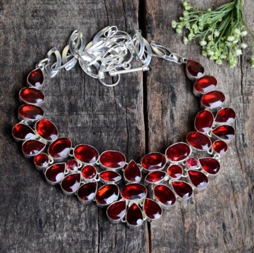 Ladies Pretty 306 Ct Lab Created Red Ruby Necklace: These lab created gemstones are VVS1 eye clean faceted mixed cuts. Mounted in .925 Sterling Silver Overlay.18" long.92.3 Total Grams or 461.5 Cttw. Simply gorgeous.