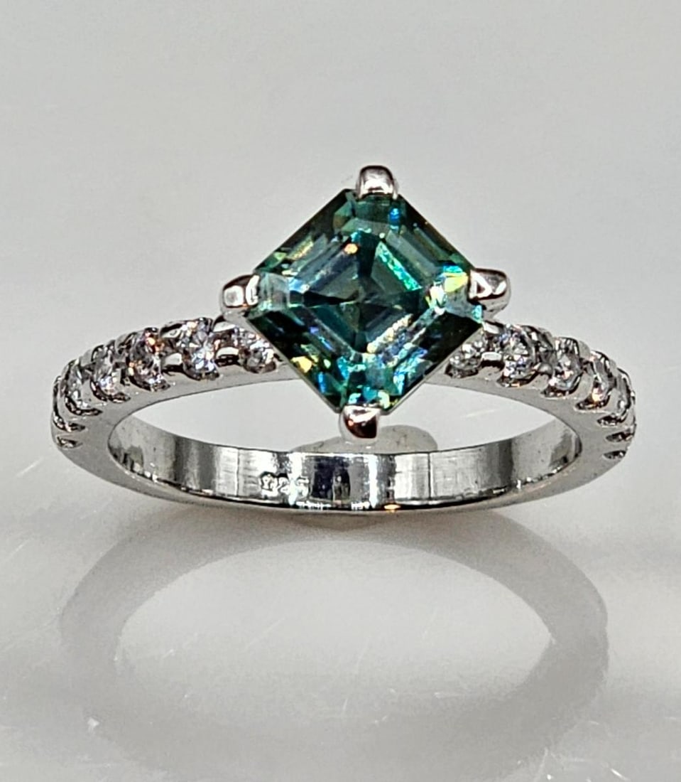 2.75 Ct VVs1 Lab Simulated Alexandrite Asscher Cut Ring: 2.75 Ct VVs1 Rare Russian Color Change Lab Created Alexandrite Asscher Cut Ring. This Russian 3.35 Ct Lab Created Color Change Alexandrite is a VVs1 Eye-Clean Fine Asscher Cut Measuring 7.4 x 7.4 mm. 
