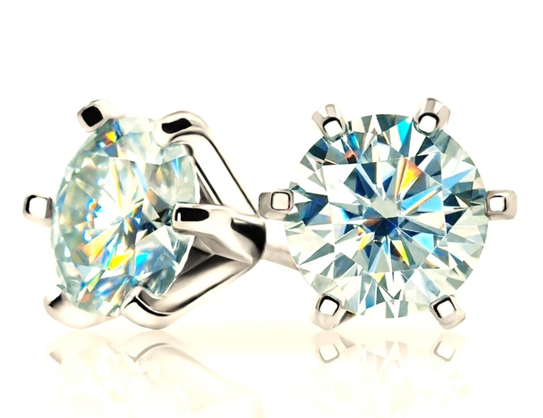 14 K White Gold Plate 2.5 Ct VVs1 Ice Blue Fire Moissanite Earrings: These Beautiful 2.5 Cwt. VVS1 Moissanite Earrings Are Near Flawless and bursting out with a full spectrum of colors. The Color is a Ice Blue. They are Brilliant Round Cuts Measuring Approx 6.7 mm each