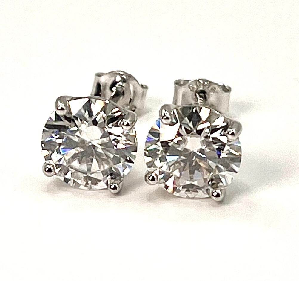 Sparkling 4 Cttw White Lab Simulated Diamond Earrings: These Large 4 Cttw Lab Simulated Diamonds are Eye Clean and White in Color. They are both 8 mm. Brilliant Round Cuts. They are mounted in solid .925 Silver. The total gram weight for the pair is 3.2 g