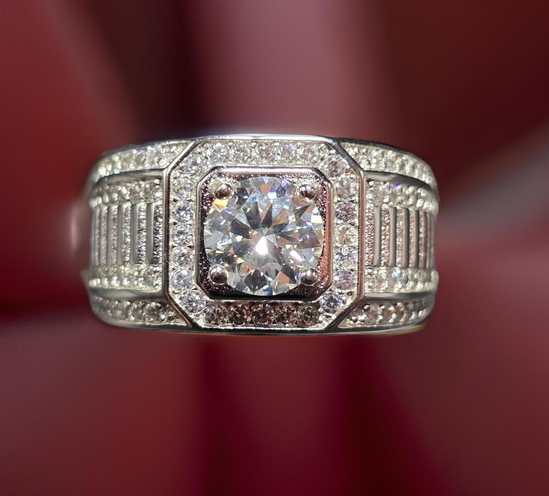 18KT White Gold Plate VVs1 Lab Simulated Diamond Ring: This 18 Kt White Gold Plate Sparkling 1 Ct Lab Simulated Diamond Centerstone is a VVs1 Brilliant Round 6.5 mm. Cut. The Color is White E-F. It is near flawless and bursting out with a full spectrum of