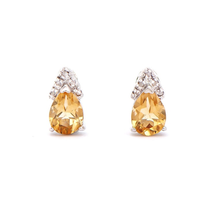 Plated Rhodium 2.06ctw Citrine and Diamond Earrings: One pair of Plated Rhodium 2.06ctw Citrine and Diamond Earrings. (2) pear shaped Citrine stones with a total weight of 2.01cts. (6) diamond with a total of 0.05cts with a color of H-I and clarity of I