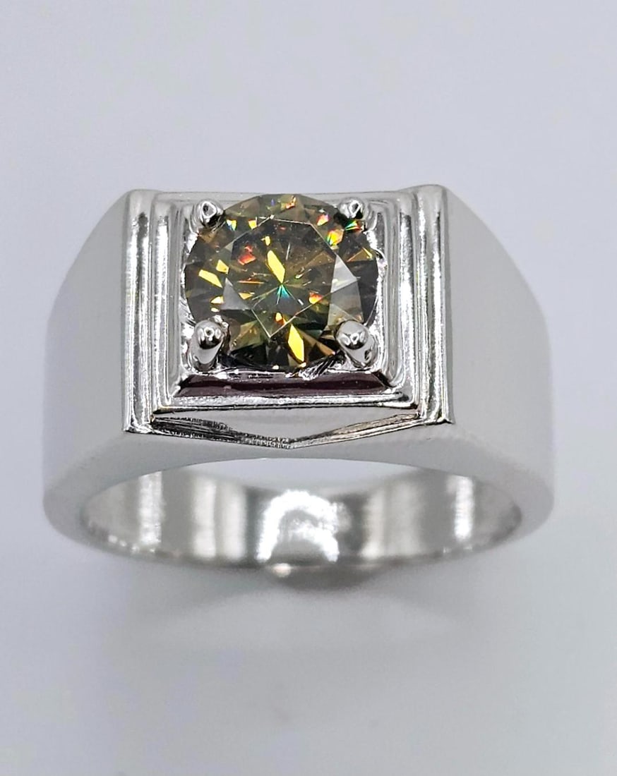14 Kt White Gold Plate 2.35 Ct Amber Green Fire Moissanite Ring: This Large 2.35 Ct Moissanite Center-stone is a VVS1 Brilliant Round 8 mm. Cut. The Color is Dark Amber Whisky Green. It is near flawless and bursting out with a full spectrum of colors. Mounted in .9