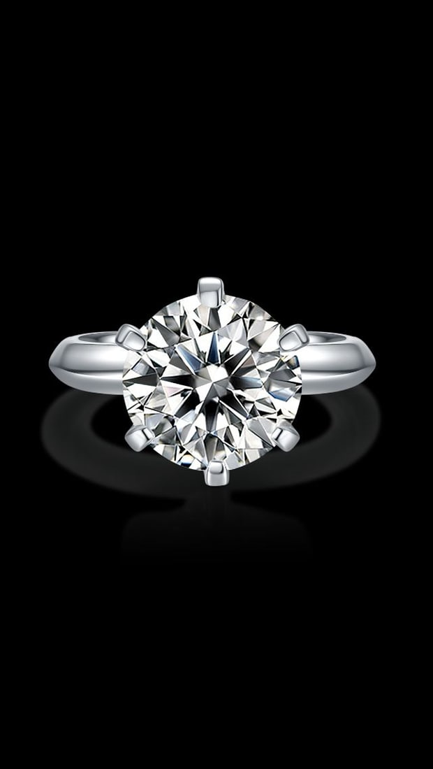 Ladies Sparkling 5 Ct Fire Moissanite Ring: Ladies Sparkling 5 Ct Solitaire VVs1 F-G Fire Moissanite Ring. This 5 Ct Moissanite Centerstone is a VVS1 Brilliant Round 10.5 mm. Cut. The Color is White F-G. It is near flawless and bursting out wit