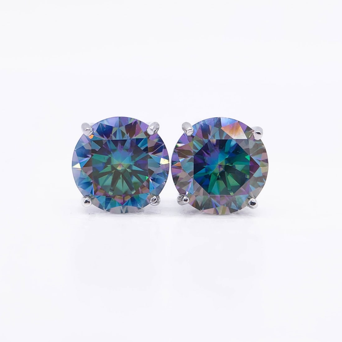 Plated 14KT White Gold 4.00ctw Color Change Simulated Alexandrite Earrings: This Pair of Russian 4 Ctw Lab Simulated Color Change Alexandrite's are both Eye-Clean Fine Brilliant Round Cuts Measuring 8mm. for a 4 Ct Total Gem Weight. The color spectrum ranges from beautiful gr